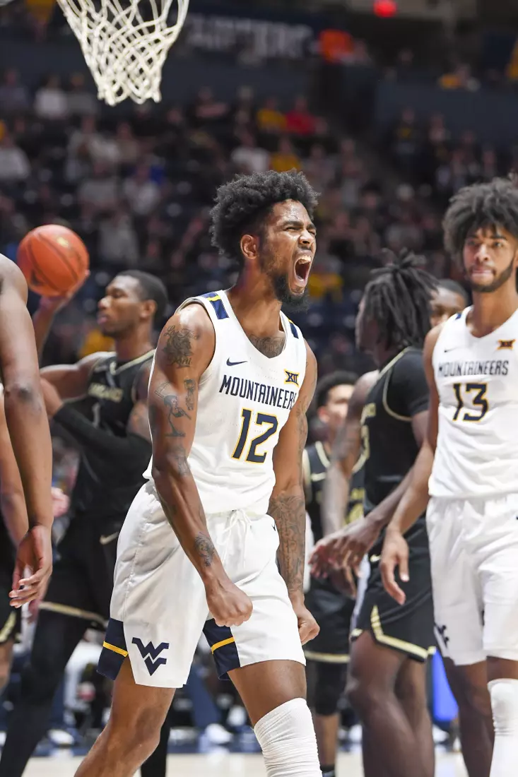 Taz Sherman celebrates the basket and the foul.