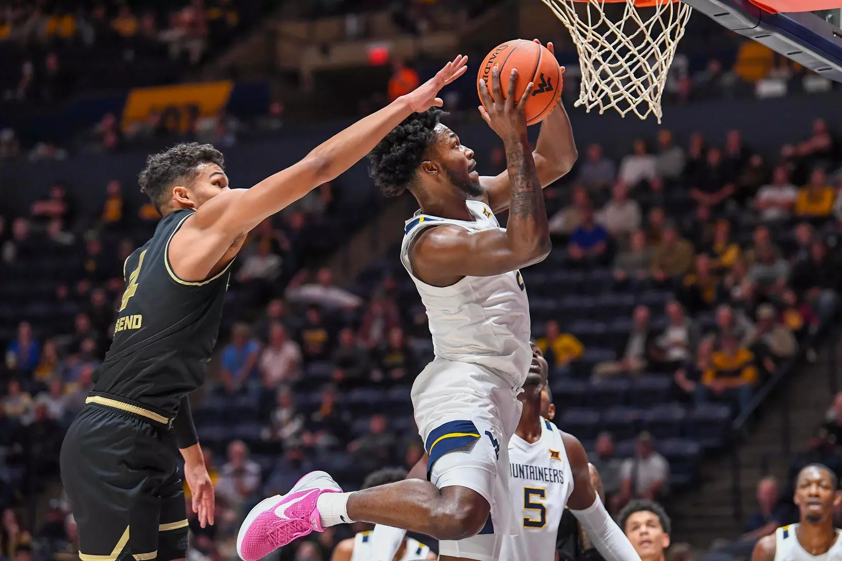 Kobe Johnson floats to the basket.