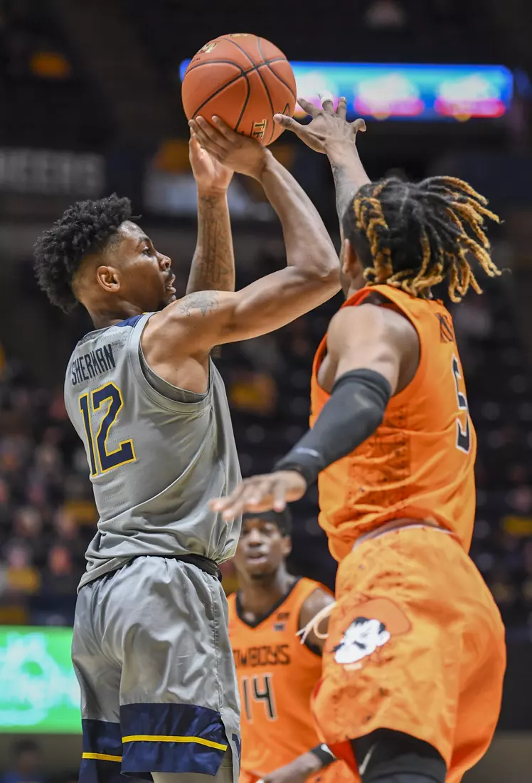 Taz Sherman hits a three-pointer.