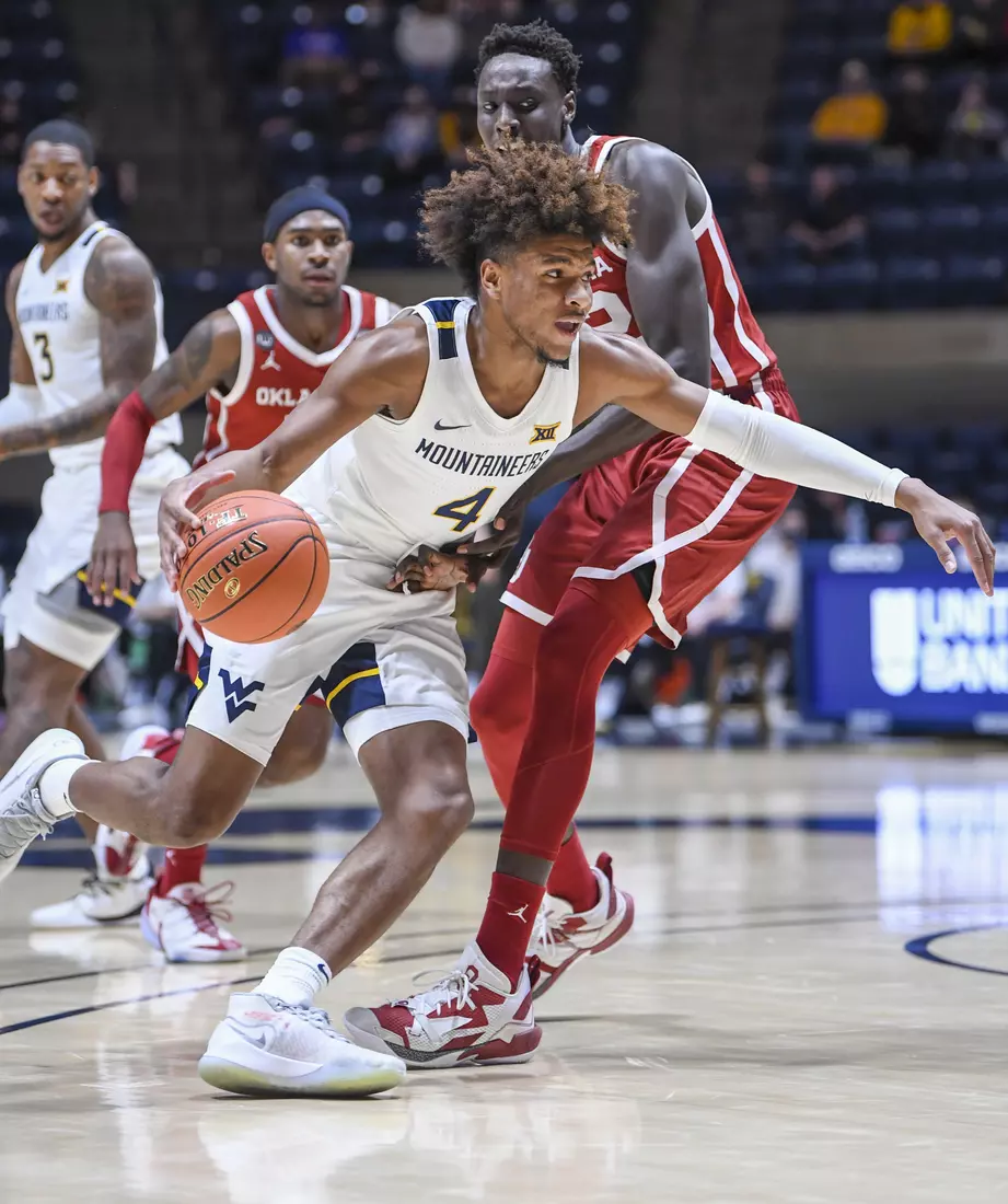 Miles McBride dribbles around a defender.