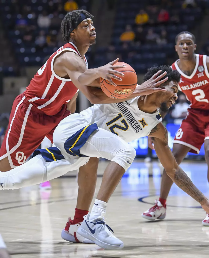 Taz Sherman is fouled on his drive.