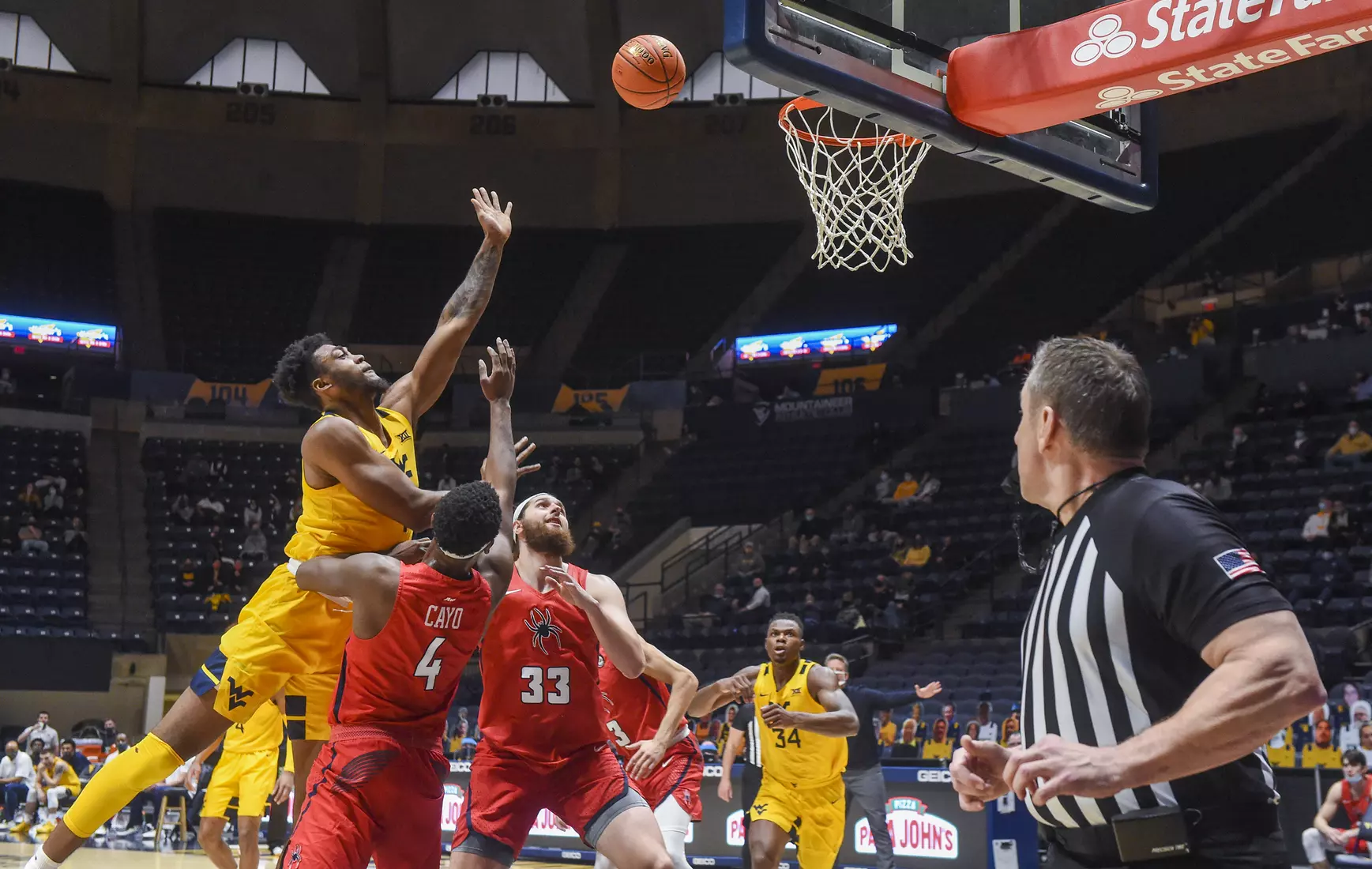 Derek Culver shoots over two defenders.