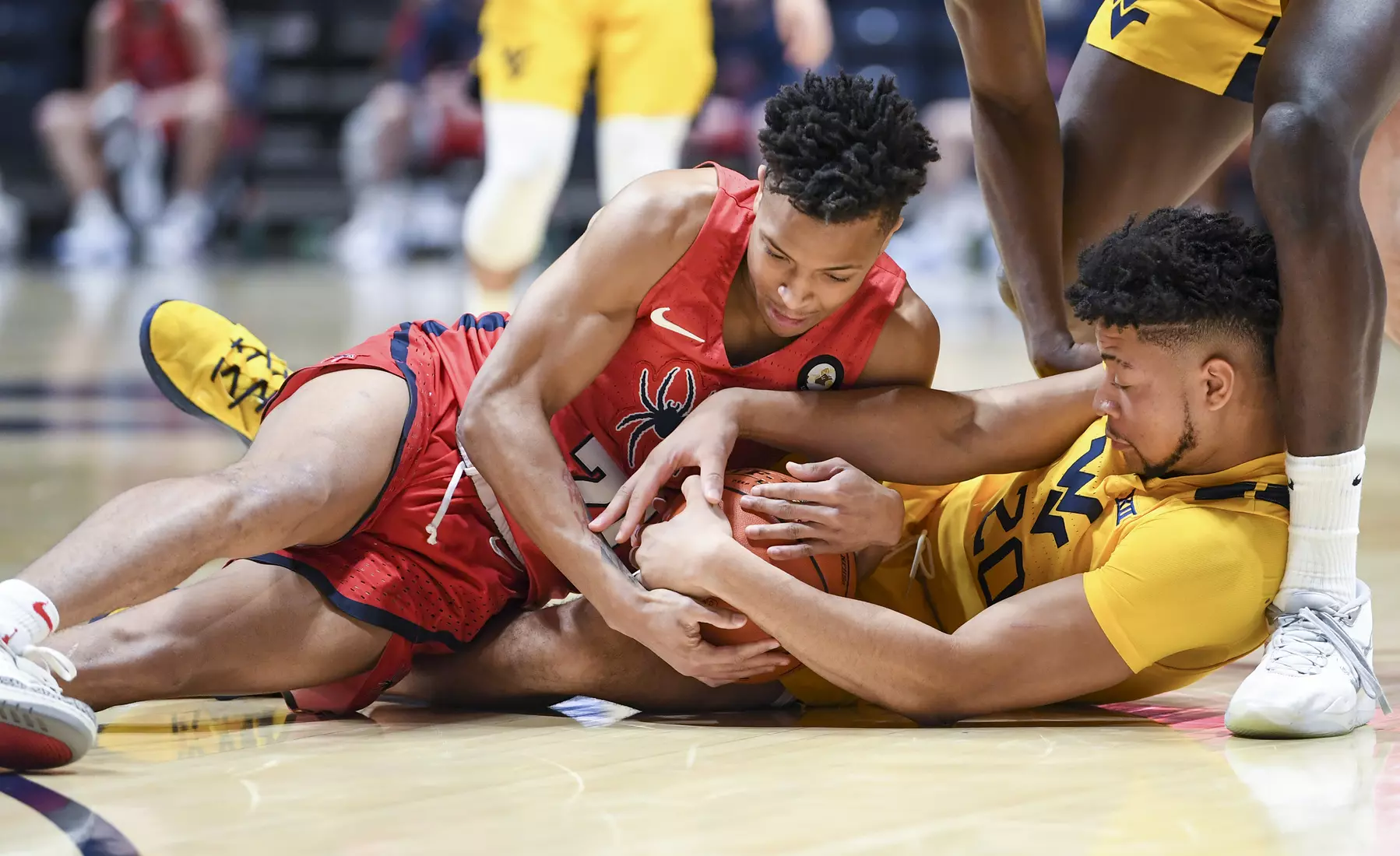 Jay Moore fights for a loose ball.