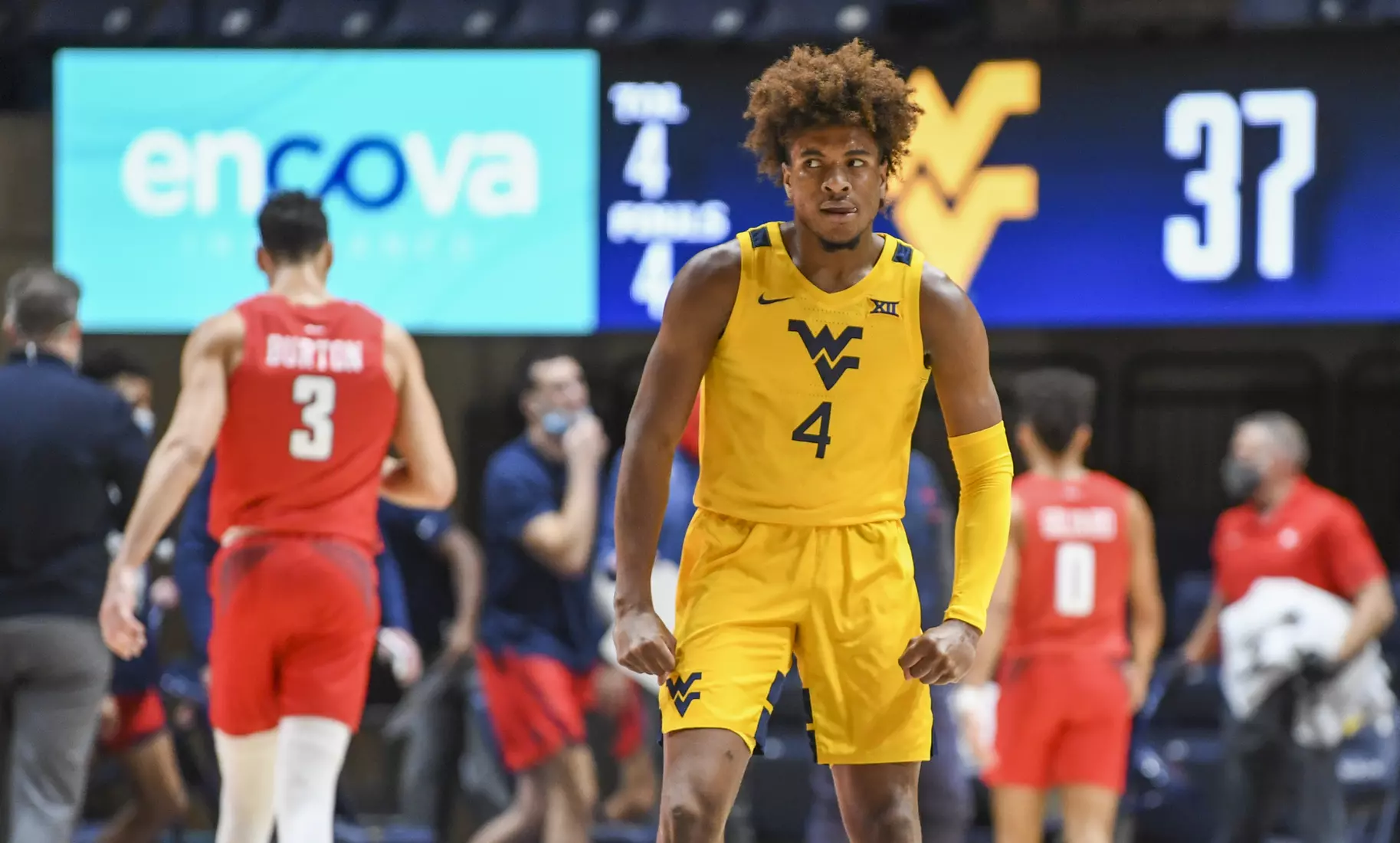 Miles McBride flexes his muscles after a big three-pointer.