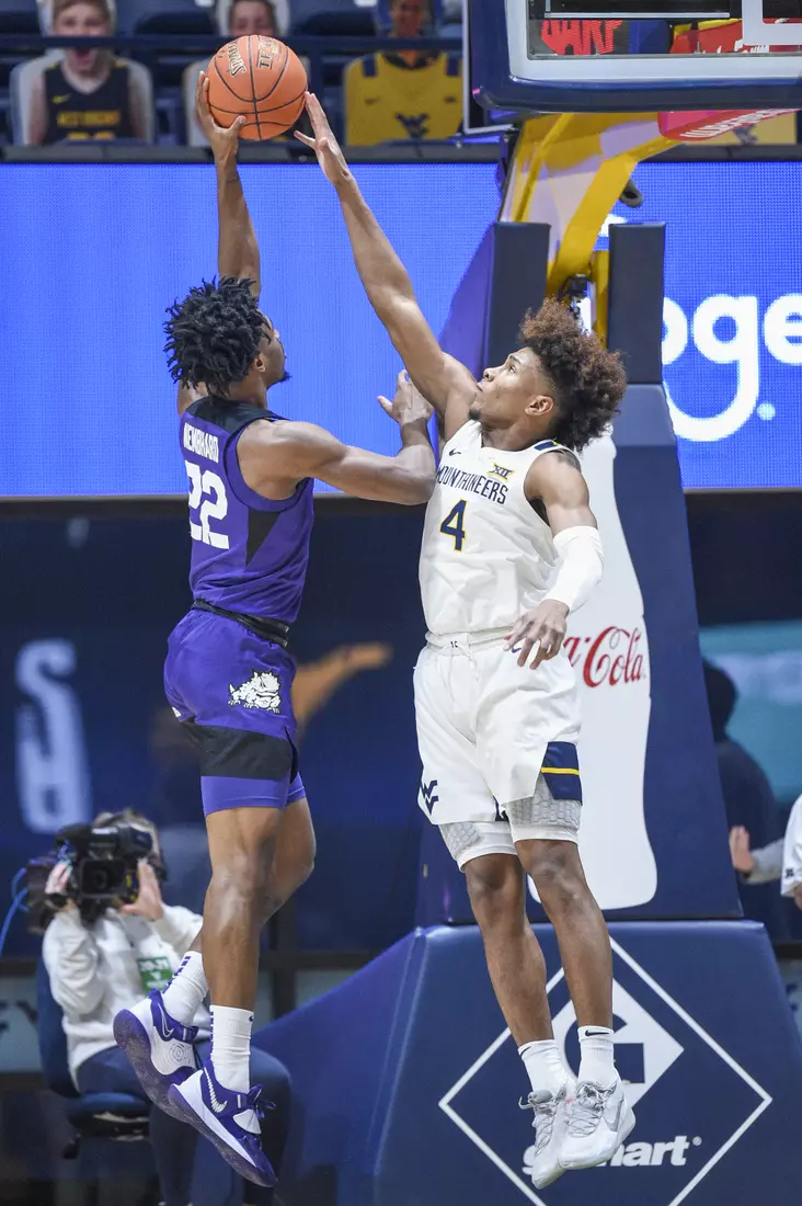 Miles McBride blocks a shot.