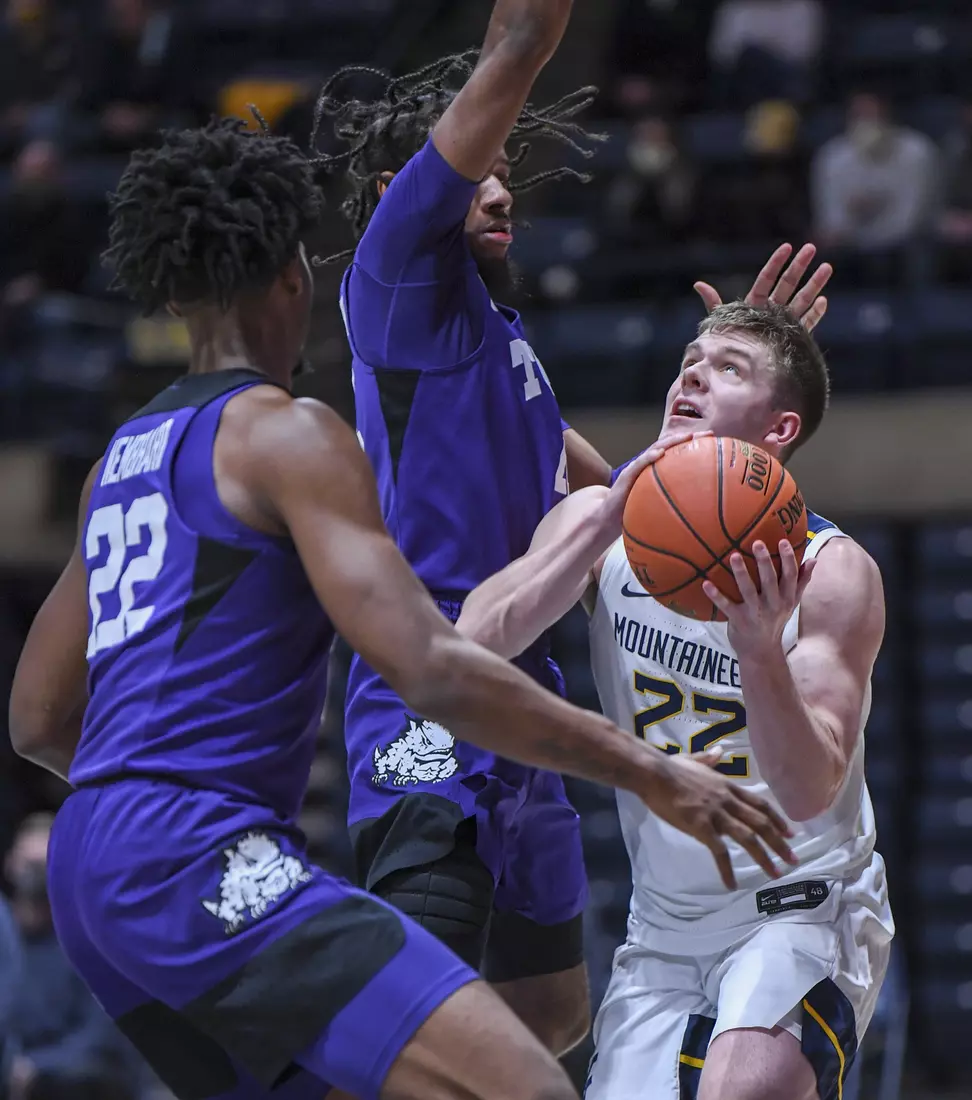 Sean McNeil works under the basket.