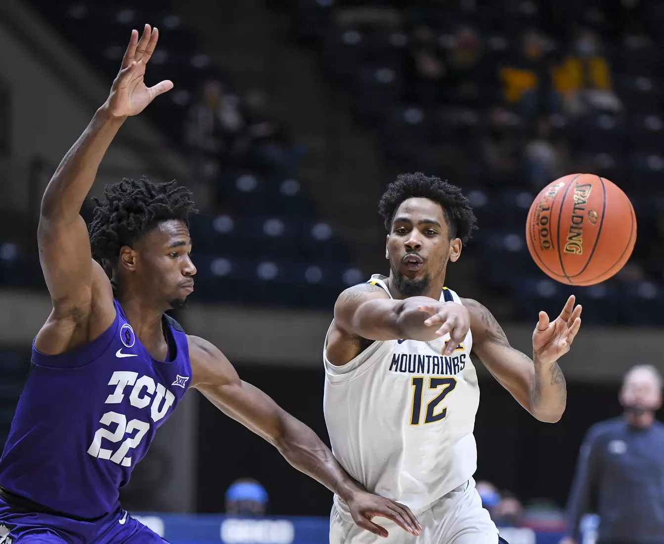 Taz Sherman passes in the paint.