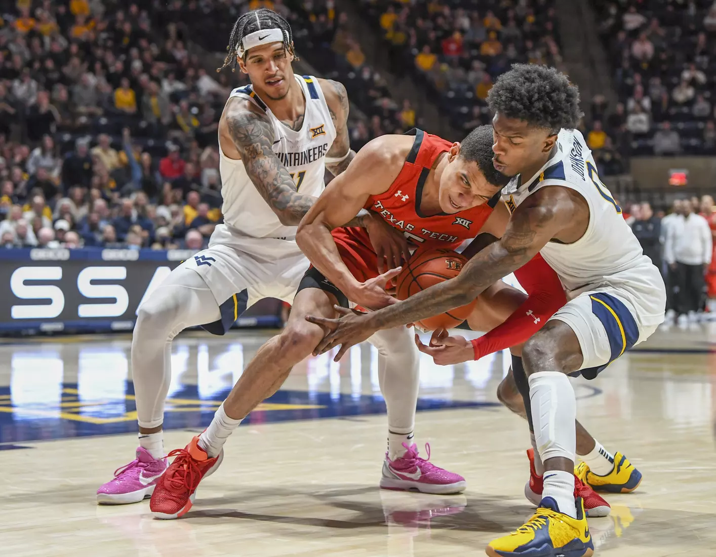 Jalen Bridges and Kedrian Johnson team-up on defense.