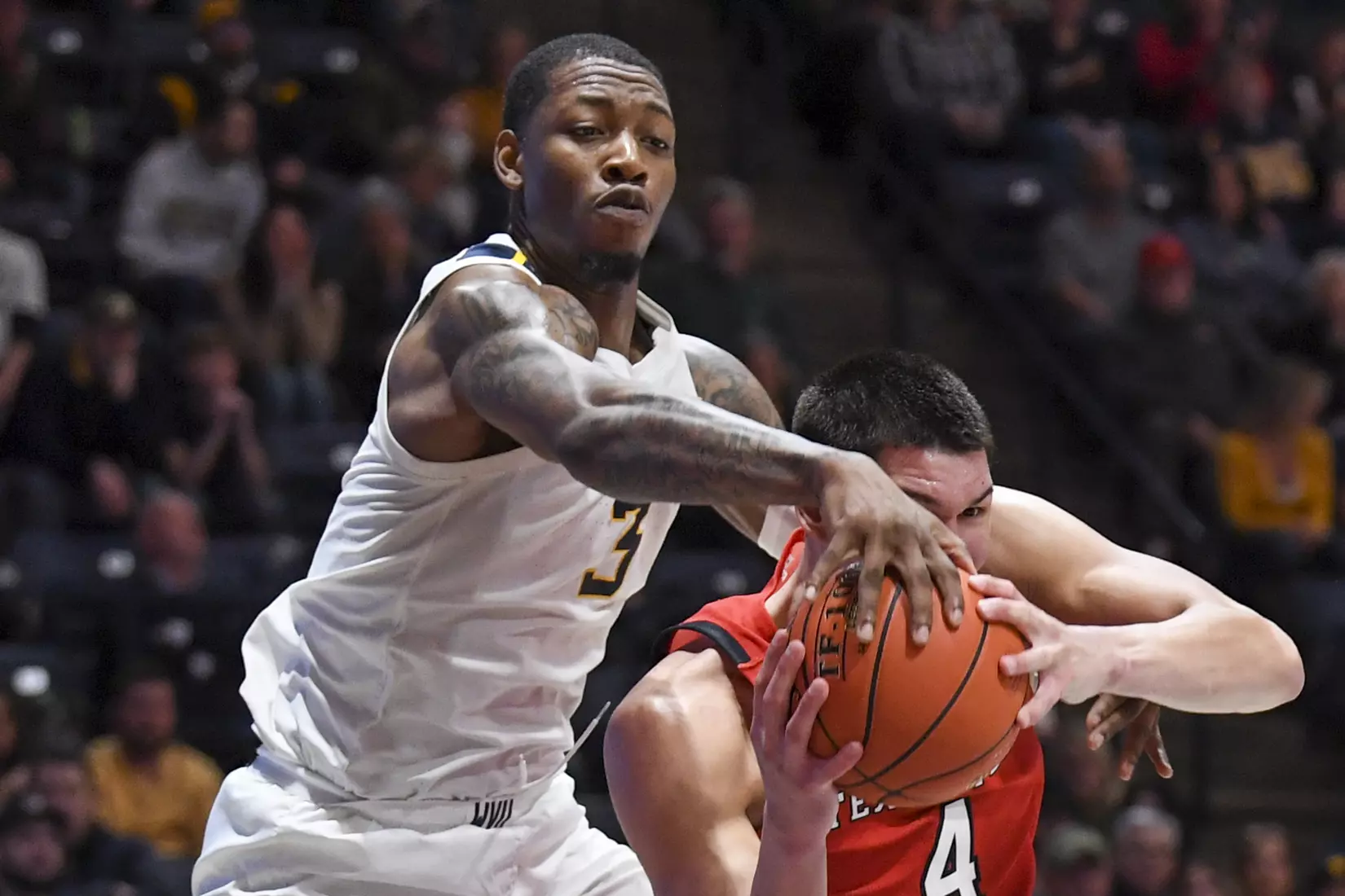 Gabe Osabuohien fights for a rebound.
