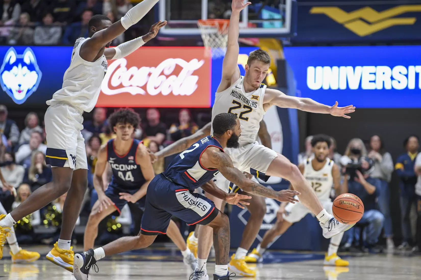 Dimon Carrigan and Sean McNeil play defense.