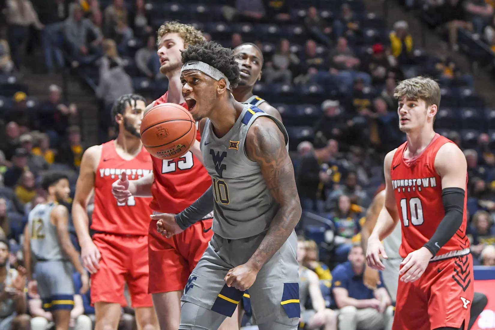 Malik Curry celebrates his basket.