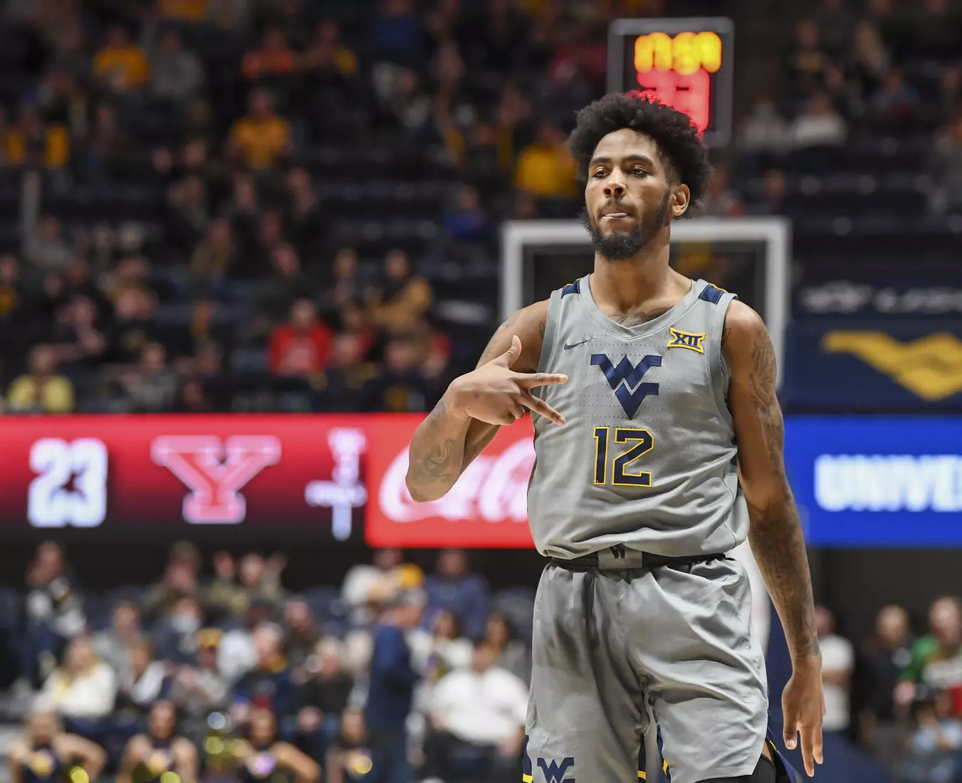 Taz Sherman celebrates a three.