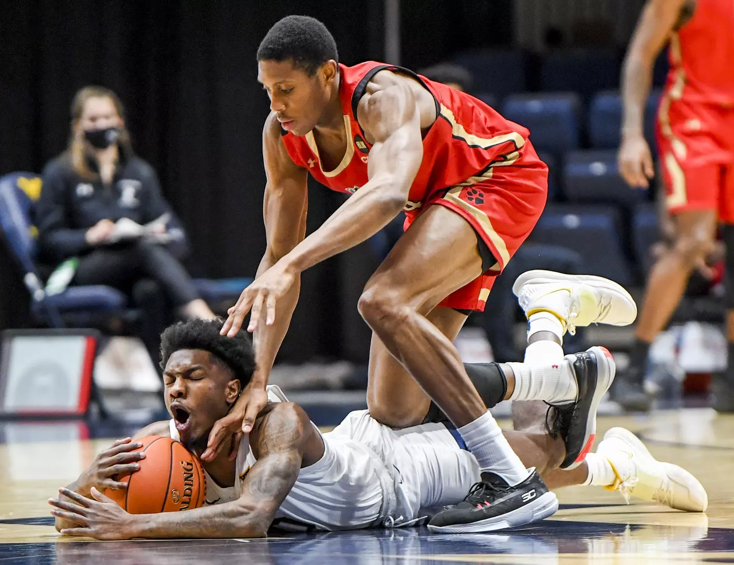 Kedrian Johnson grabs the loose ball.