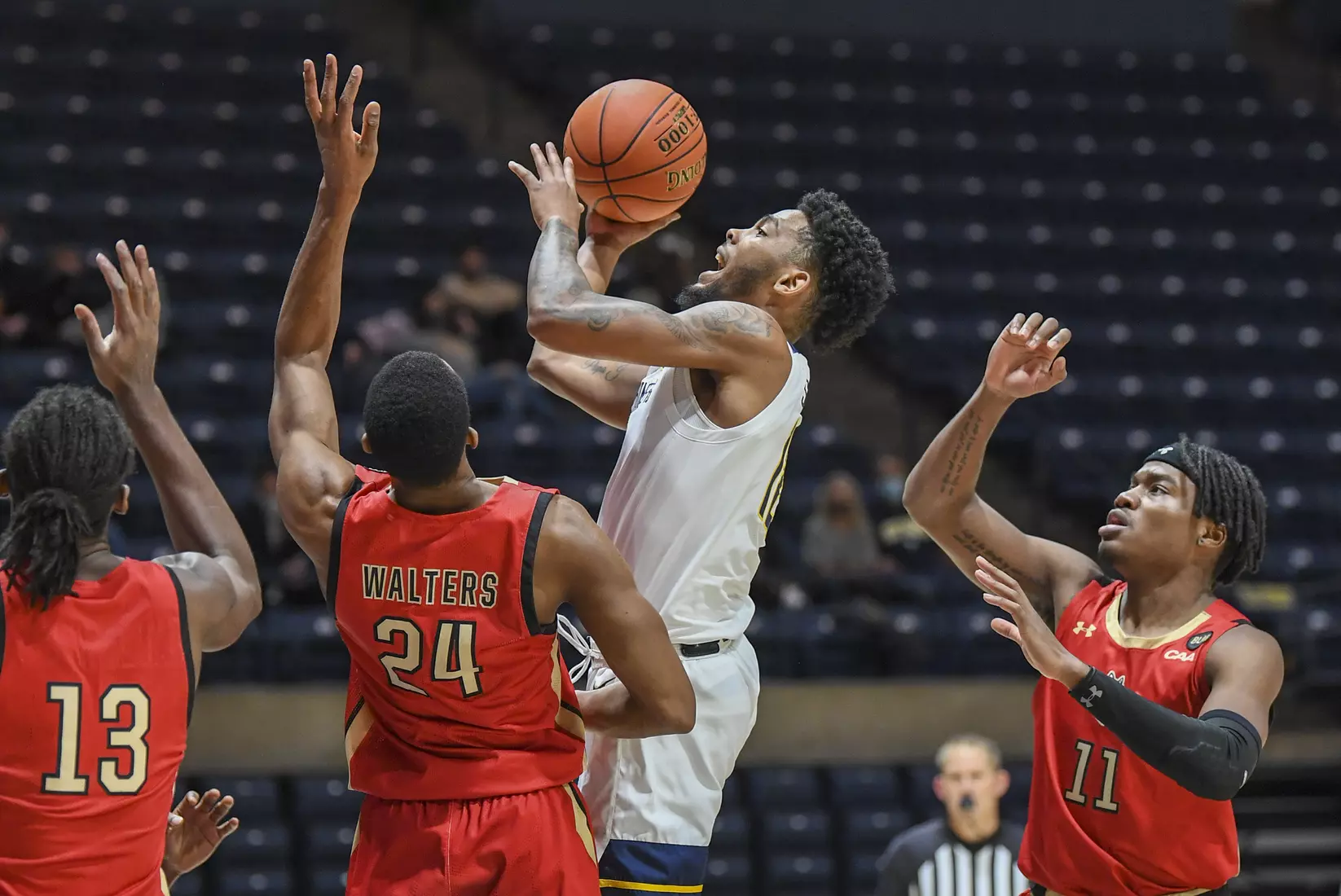 Taz Sherman shoots for two points.