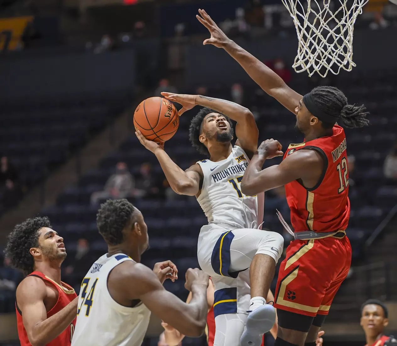 Taz Sherman shoots for two points.