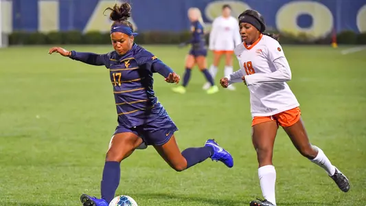 Enzi Broussard advances a ball.