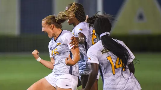Julianne Vallerand begins the celebration after scoring the Mountaineers second goal.