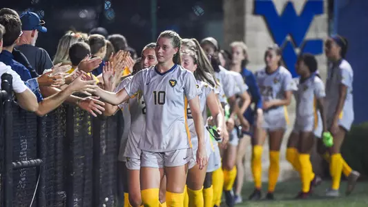 Jordan Brewster leads the team celebration.