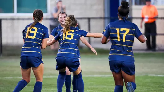 Jessica Lisi celebrates scoring the Mountaineers first goal.