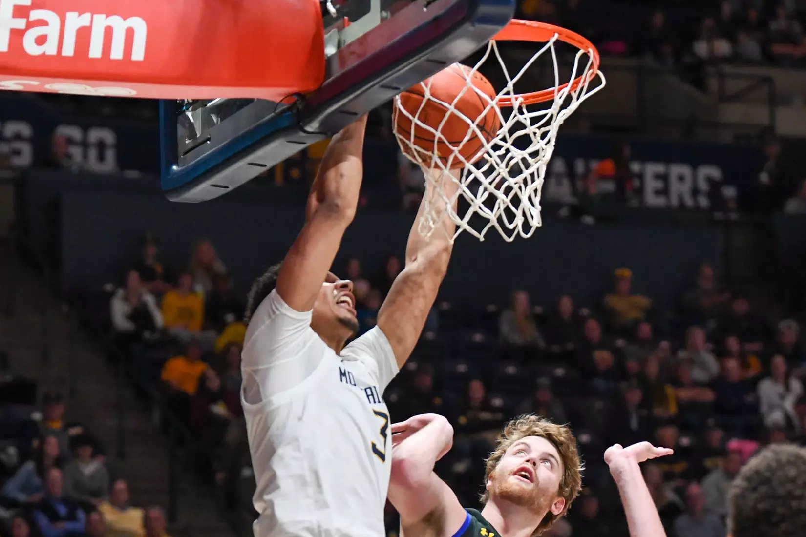 Tre Mitchell slams.