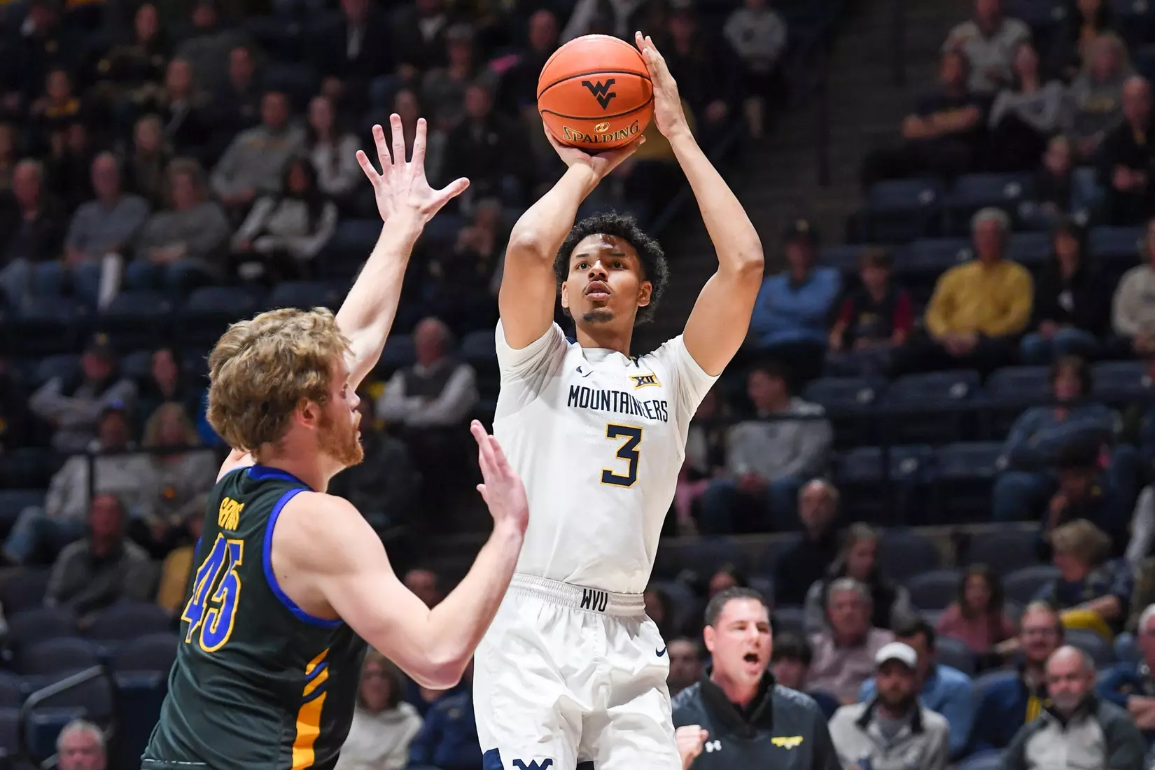 Tre Mitchell shoots for three.