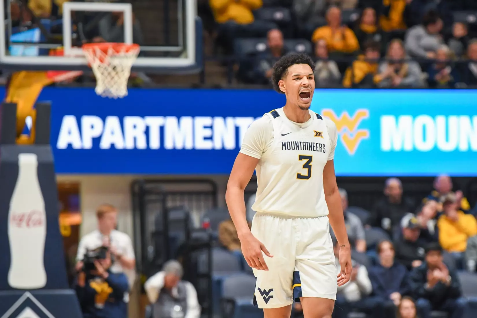 Tre Mitchell celebrates a three.