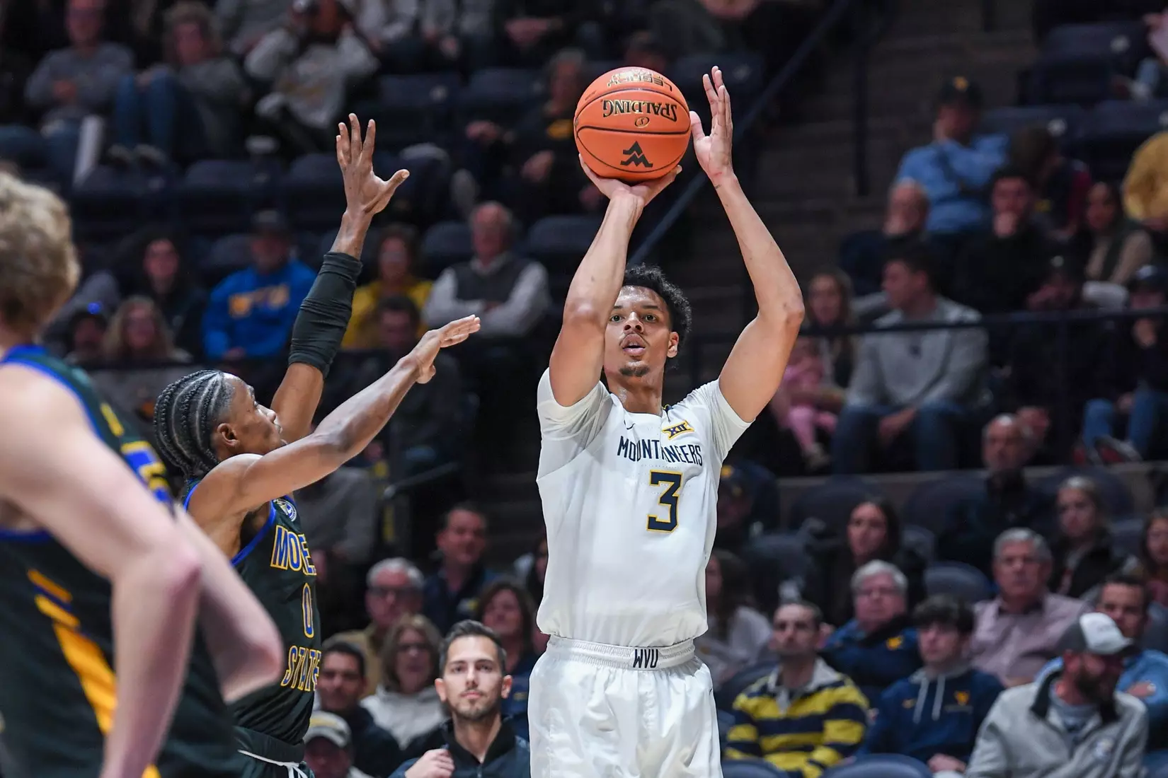 Tre Mitchell shoots for three.