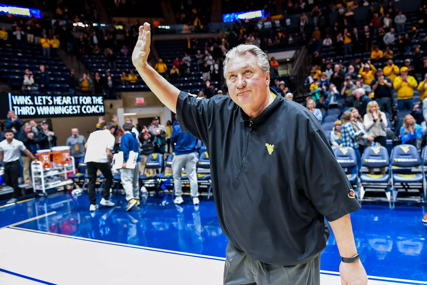 Bob Huggins waves to the crowd.