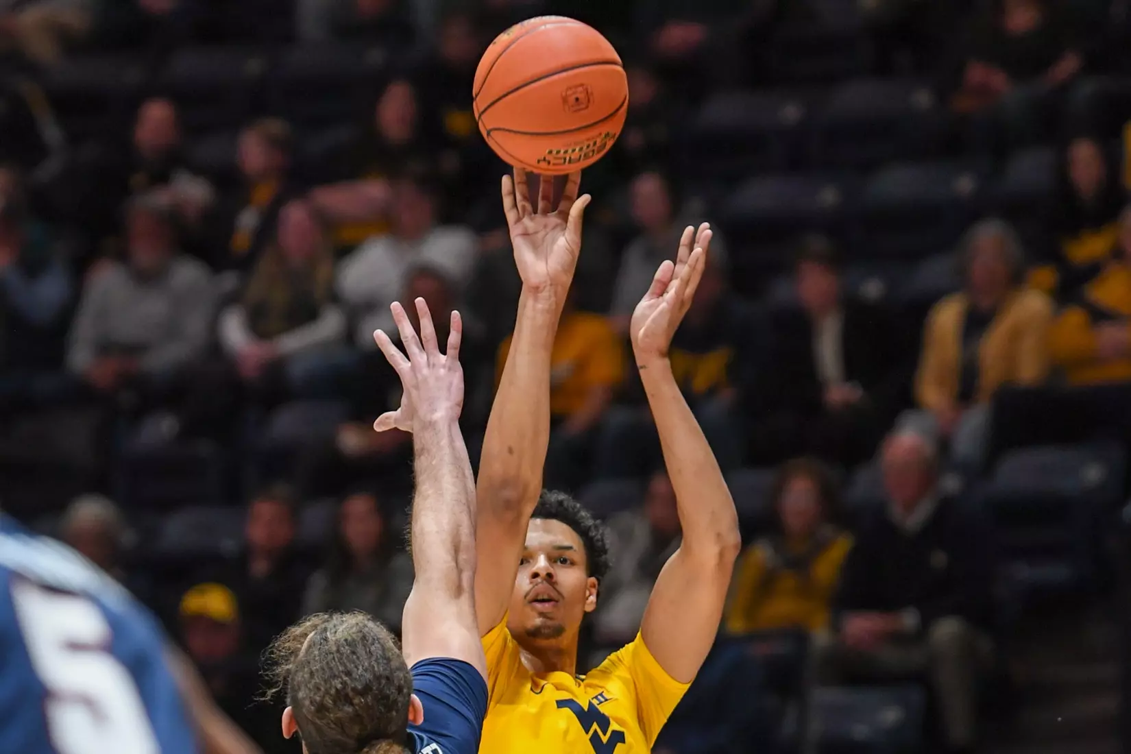 Tre Mitchell shoots a three.
