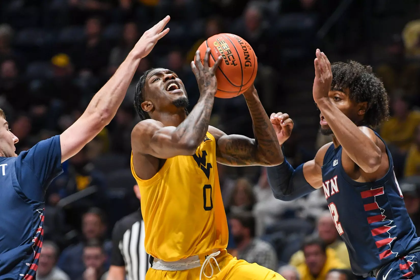 Kedrian Johnson drives for two.