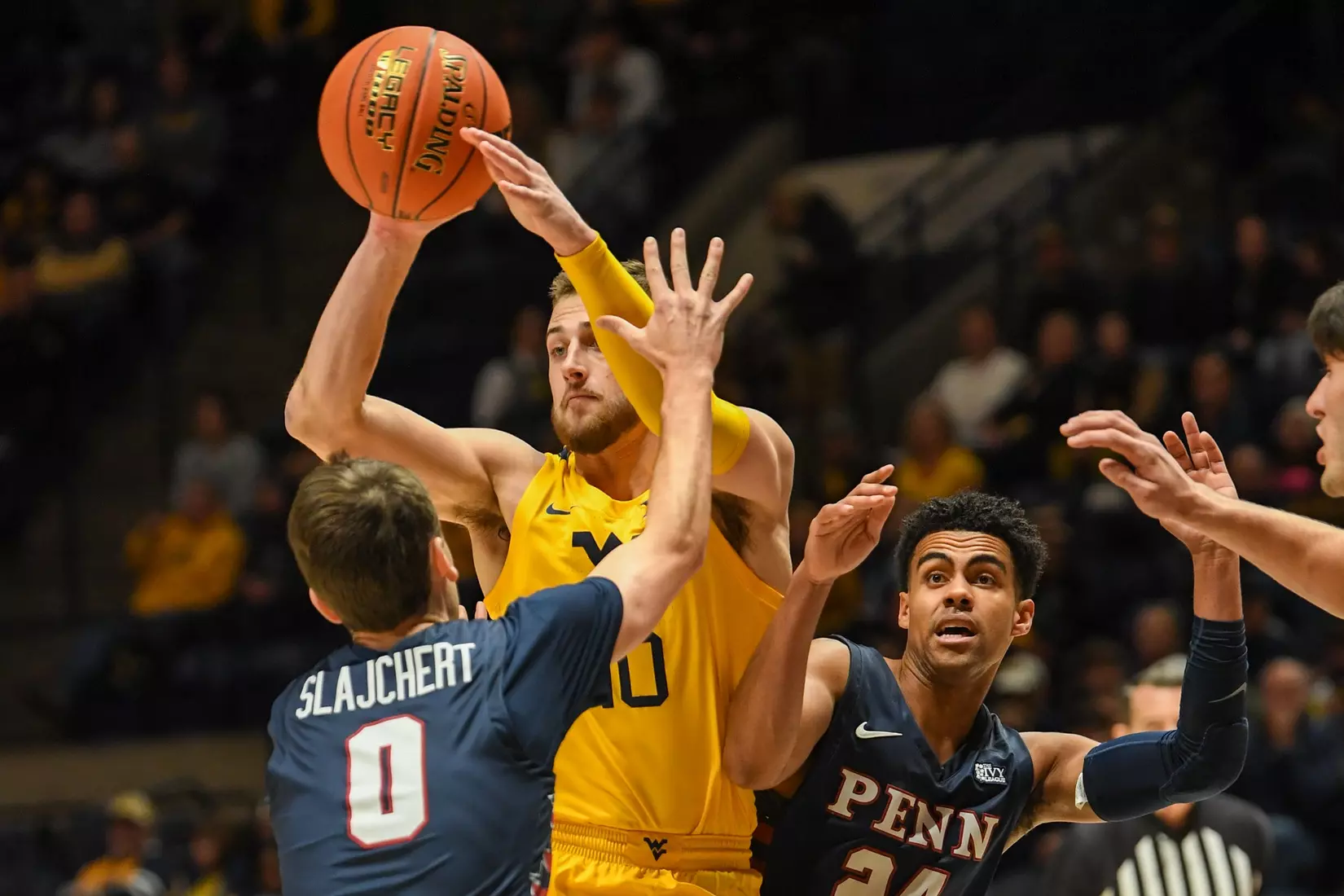 Erik Stevenson passes in the paint.