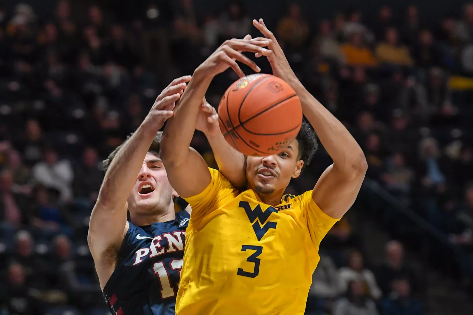 Tre Mitchell fights for a rebound.