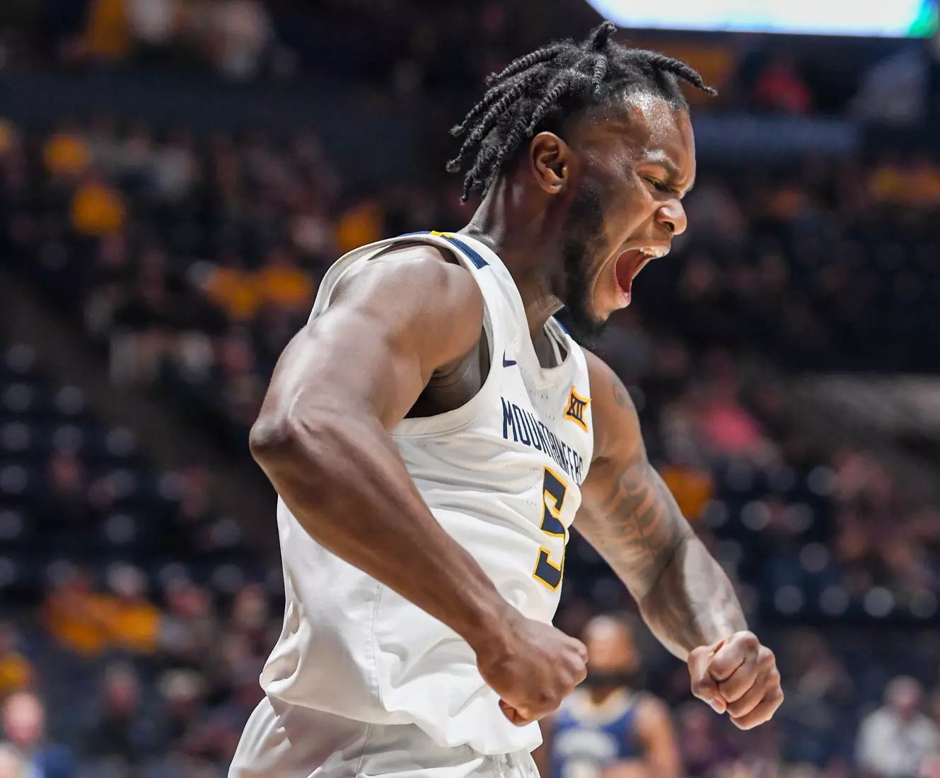 Joe Toussaint celebrates a big basket.