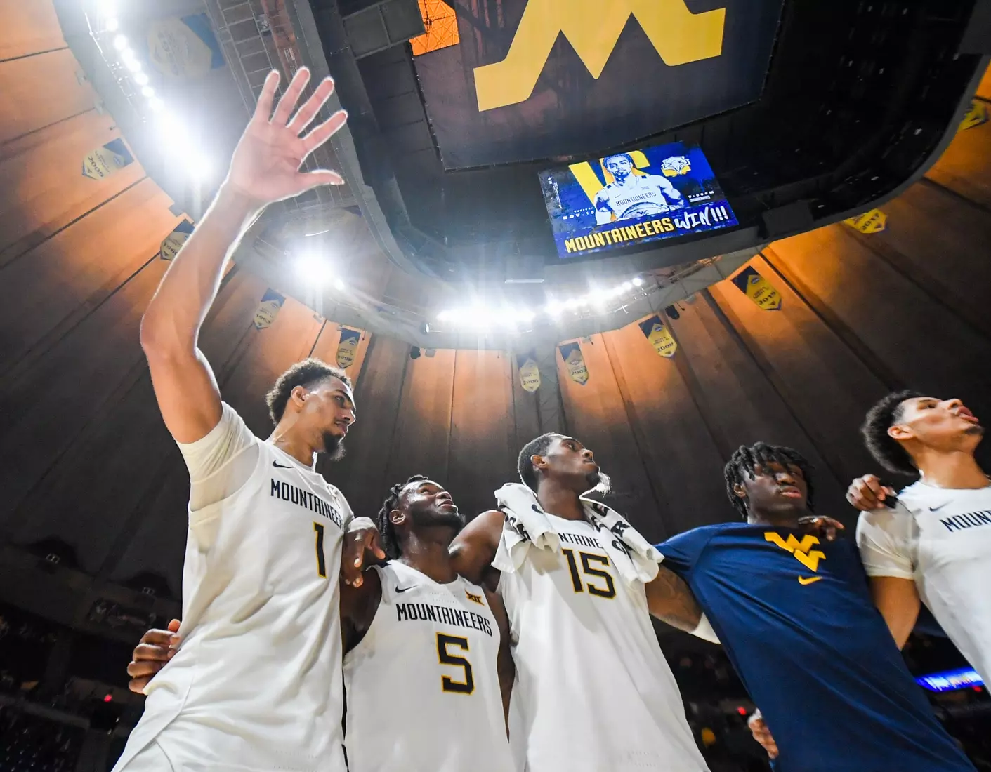 Emmitt Matthews Jr. and the Mountaineers celebrate winning the season opener.