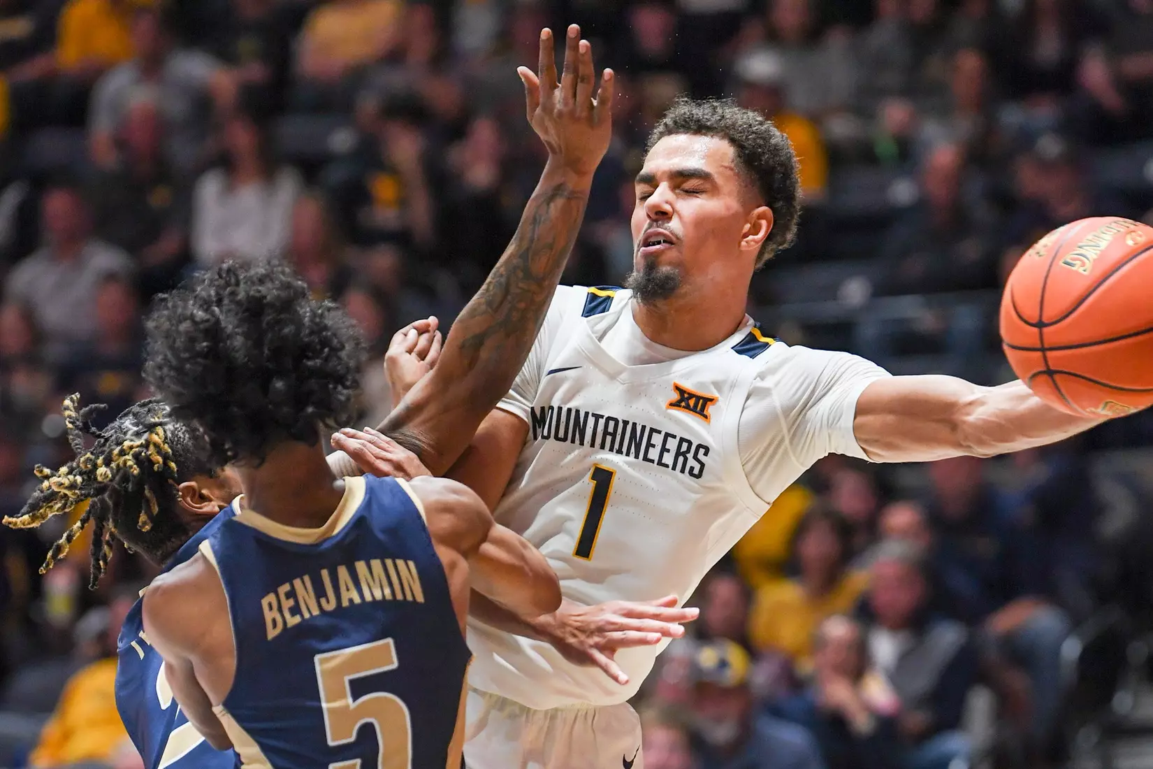Emmitt Matthews Jr. passes under the basket.