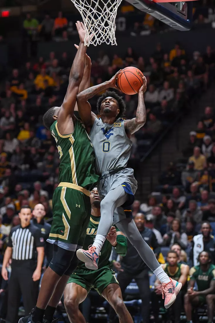 Kedrian Johnson is fouled while driving to the hoop.