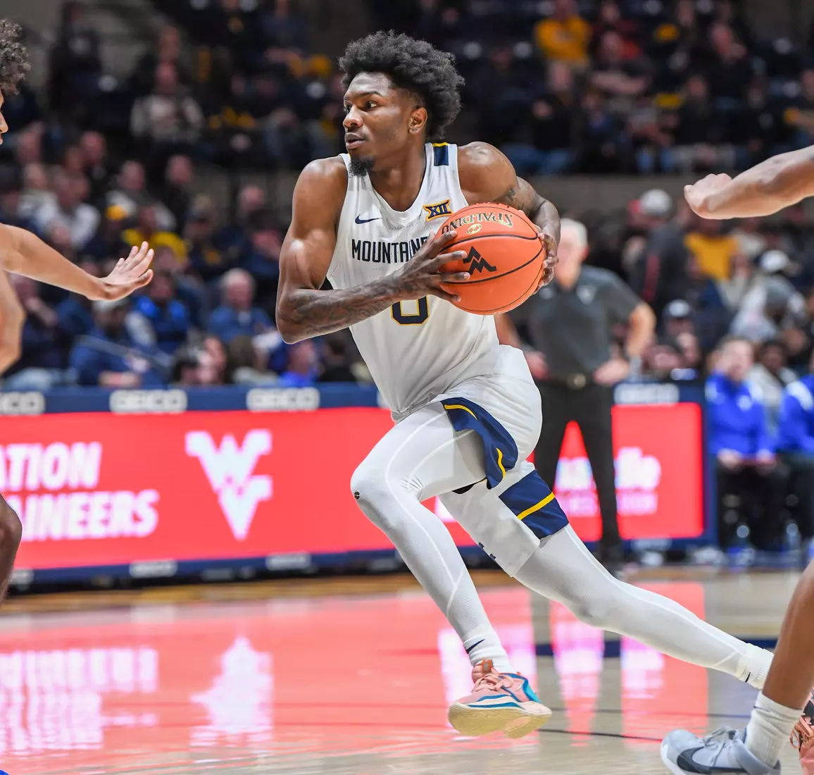 Kedrian Johnson drives.