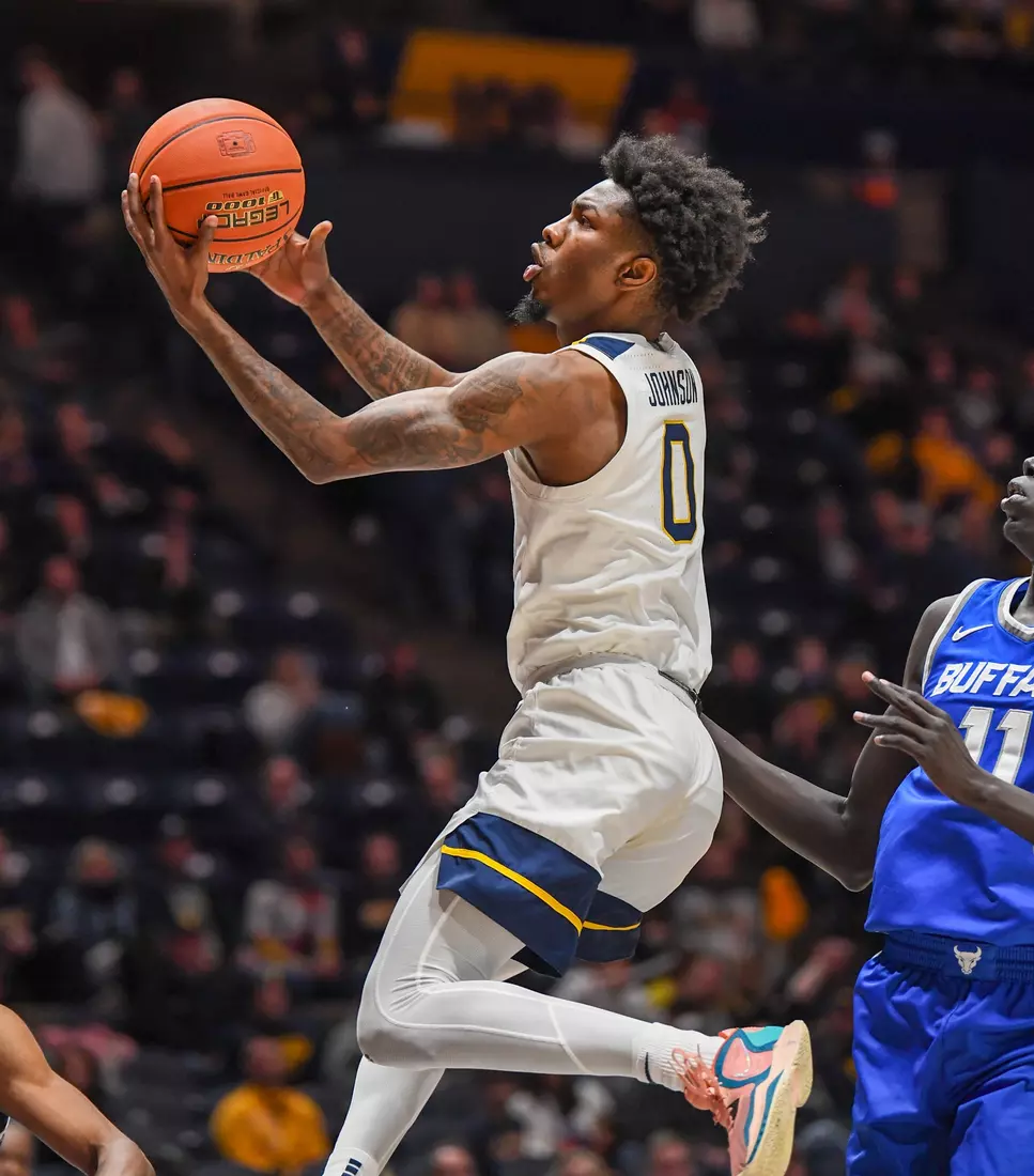 Kedrian Johnson scores.