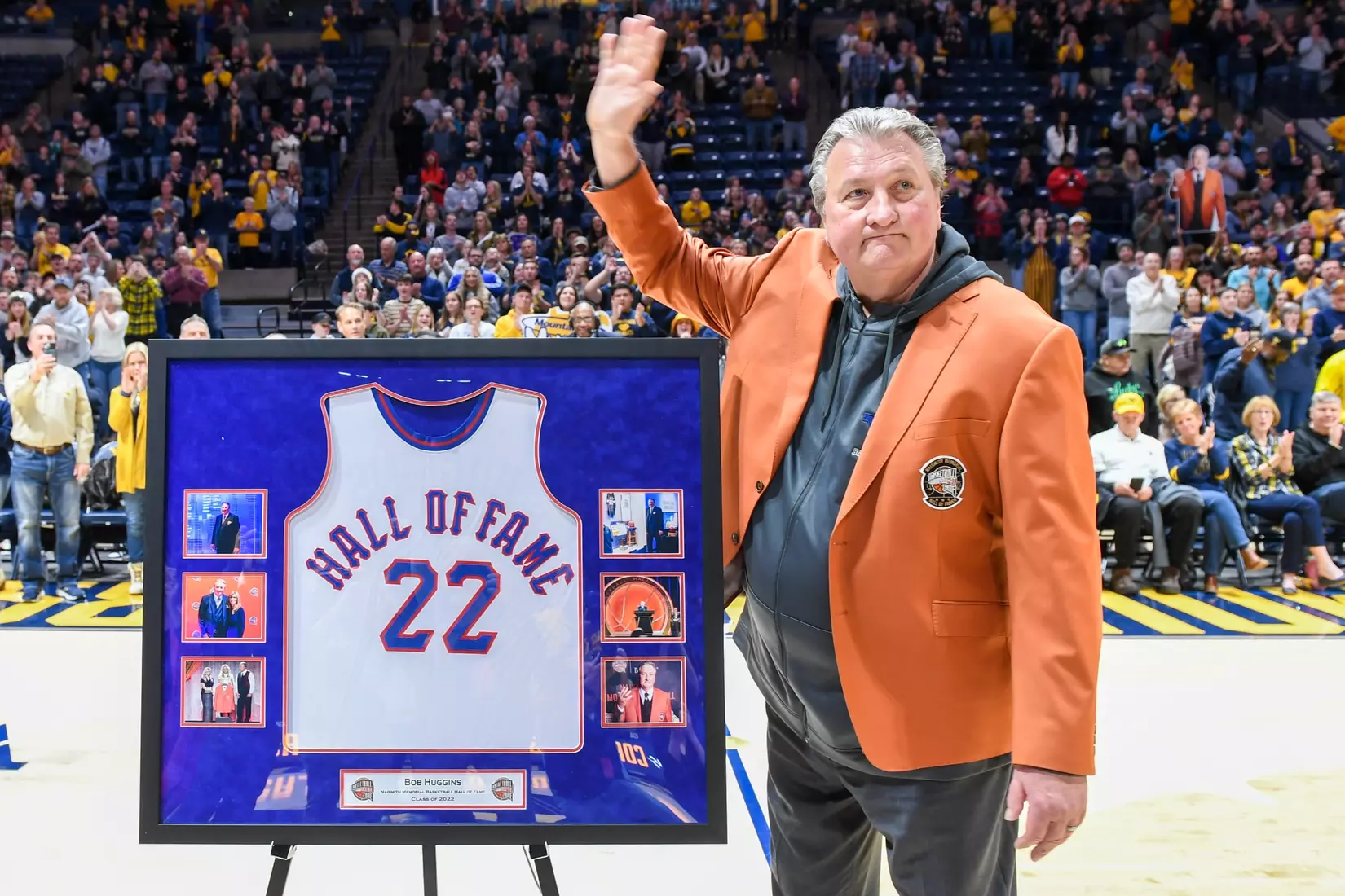 Bob Huggins waves to the crowd.