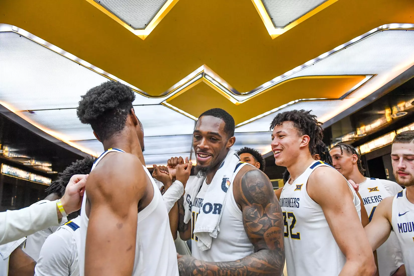 Jimmy Bell Jr. is congratulated in the locker room.