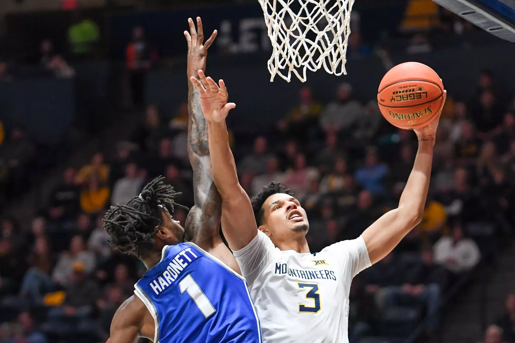 Tre Mitchell on the layup.