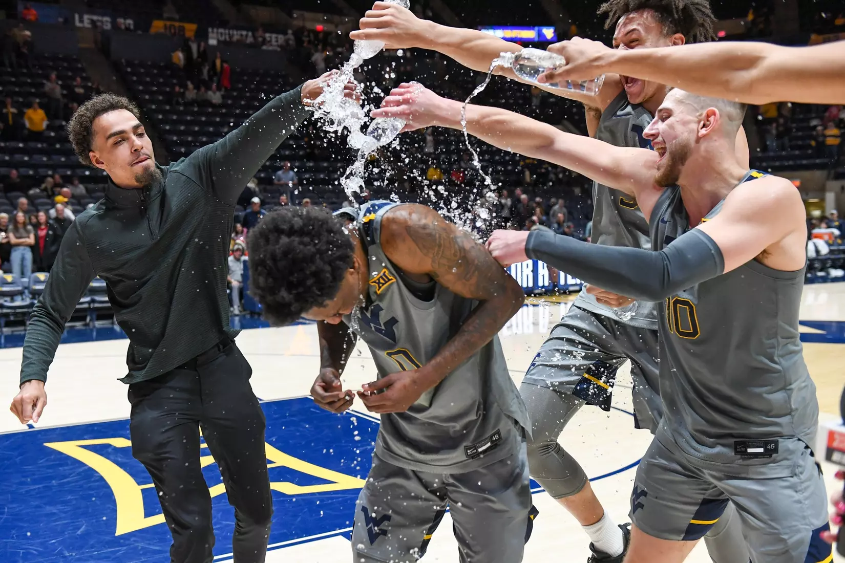 Kedrian Johnson gets the water treatment during his live TV interview.