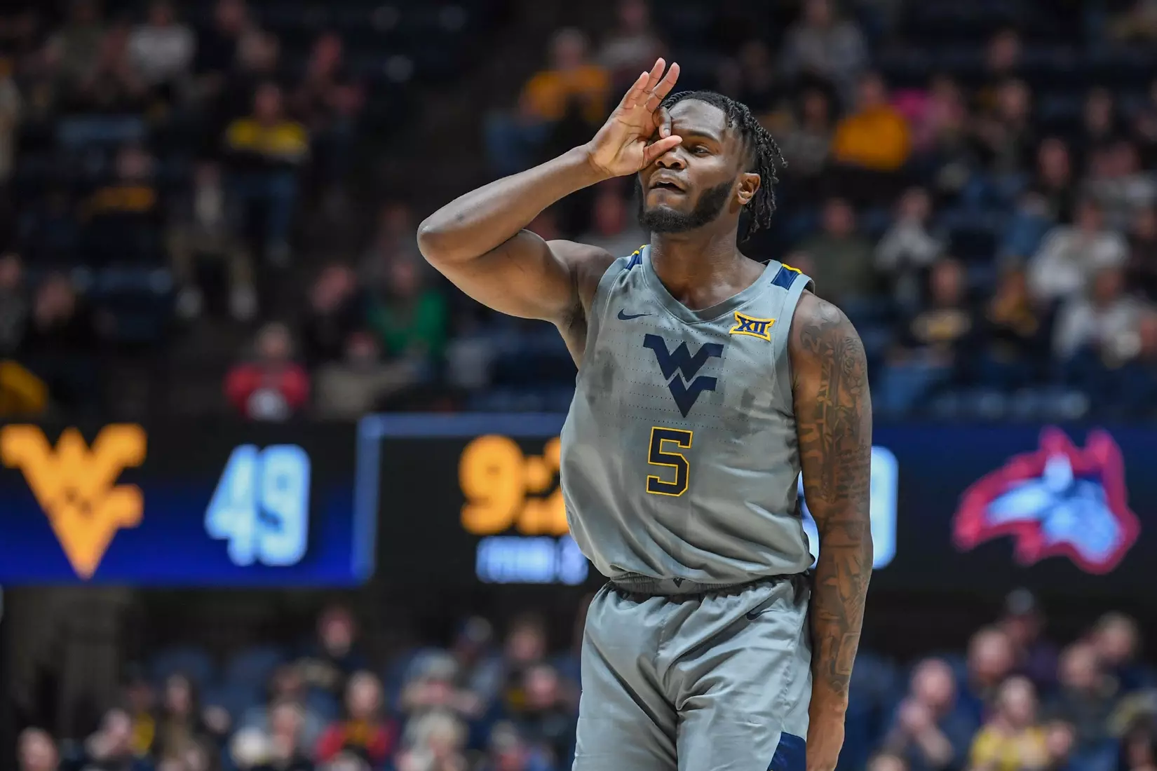 Joe Toussaint celebrates a three-pointer.