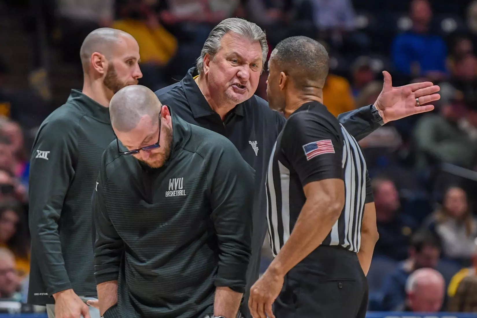 Bob Huggins communicates his feelings to the official.