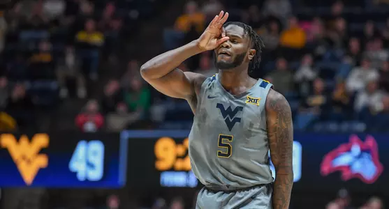 Joe Toussaint celebrates a three-pointer.