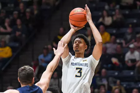 Tre Mitchell hits a three.