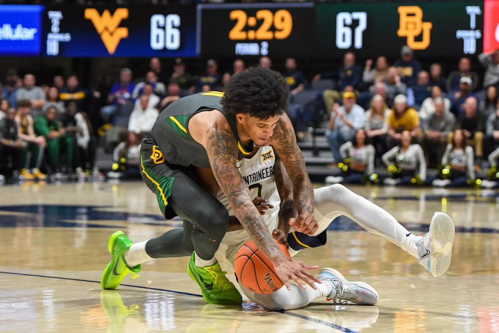 Kedrian Johnson is knocked to the floor.