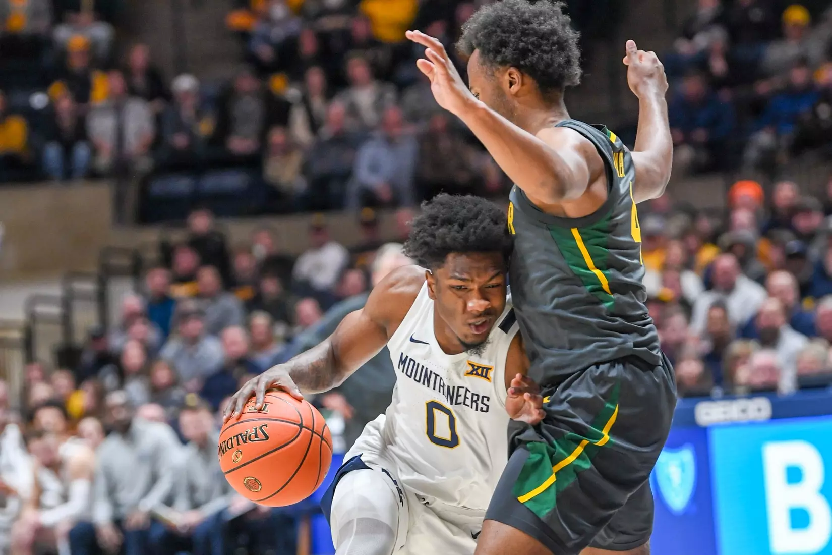 Kedrian Johnson drives.