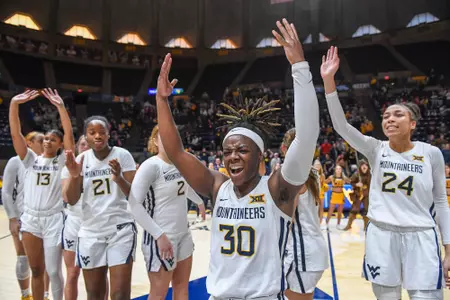 Madisen Smith and the team celebrate the win over Baylor.