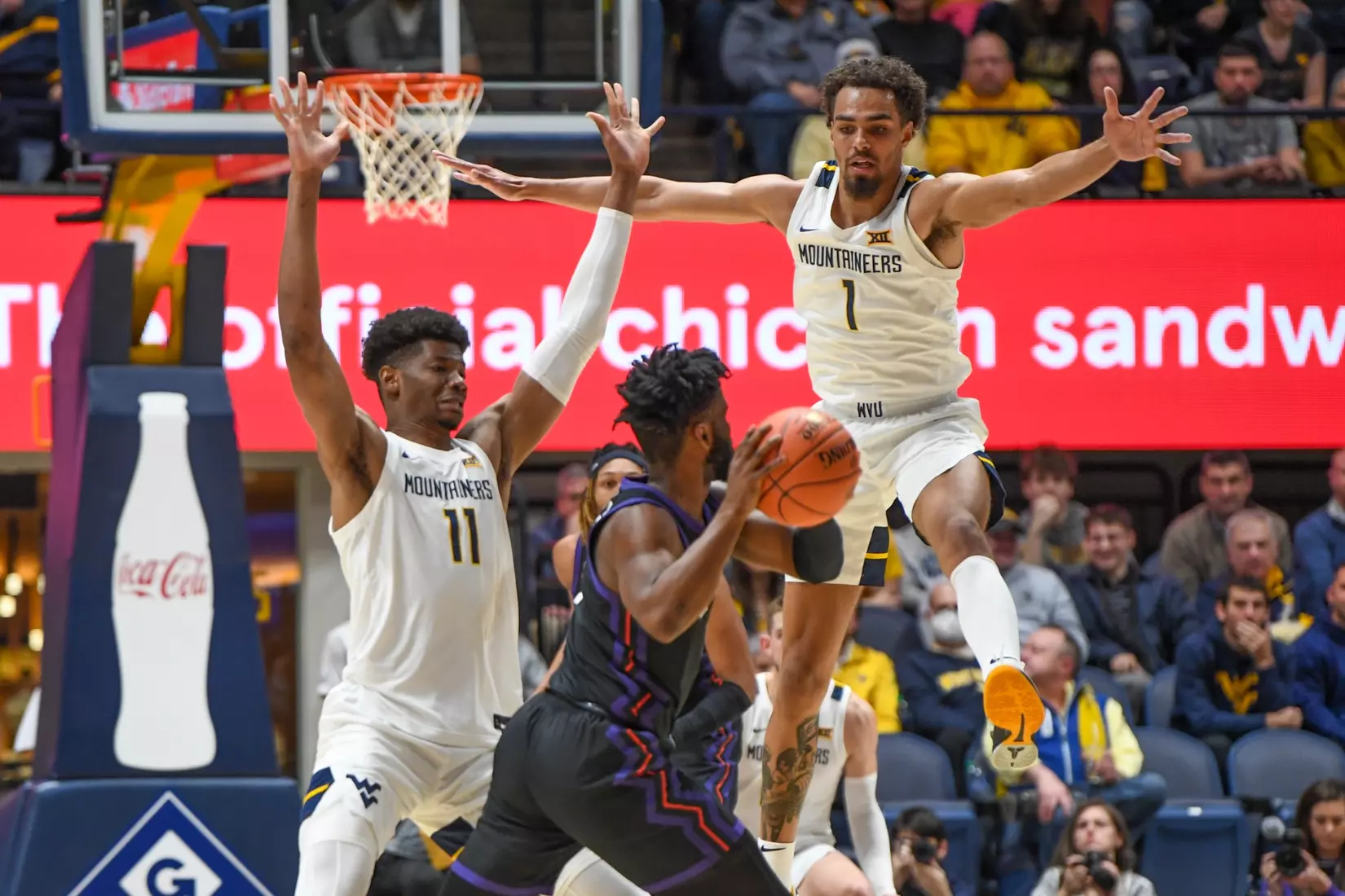 Mohamed Wague and Emmitt Mattthews Jr. play defense.